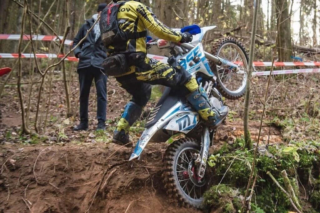 dirt bike with tires designed for riding on rough surfaces